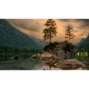 Scenic daytime lake view with green trees and brown rock formation, ideal for nature blogs.